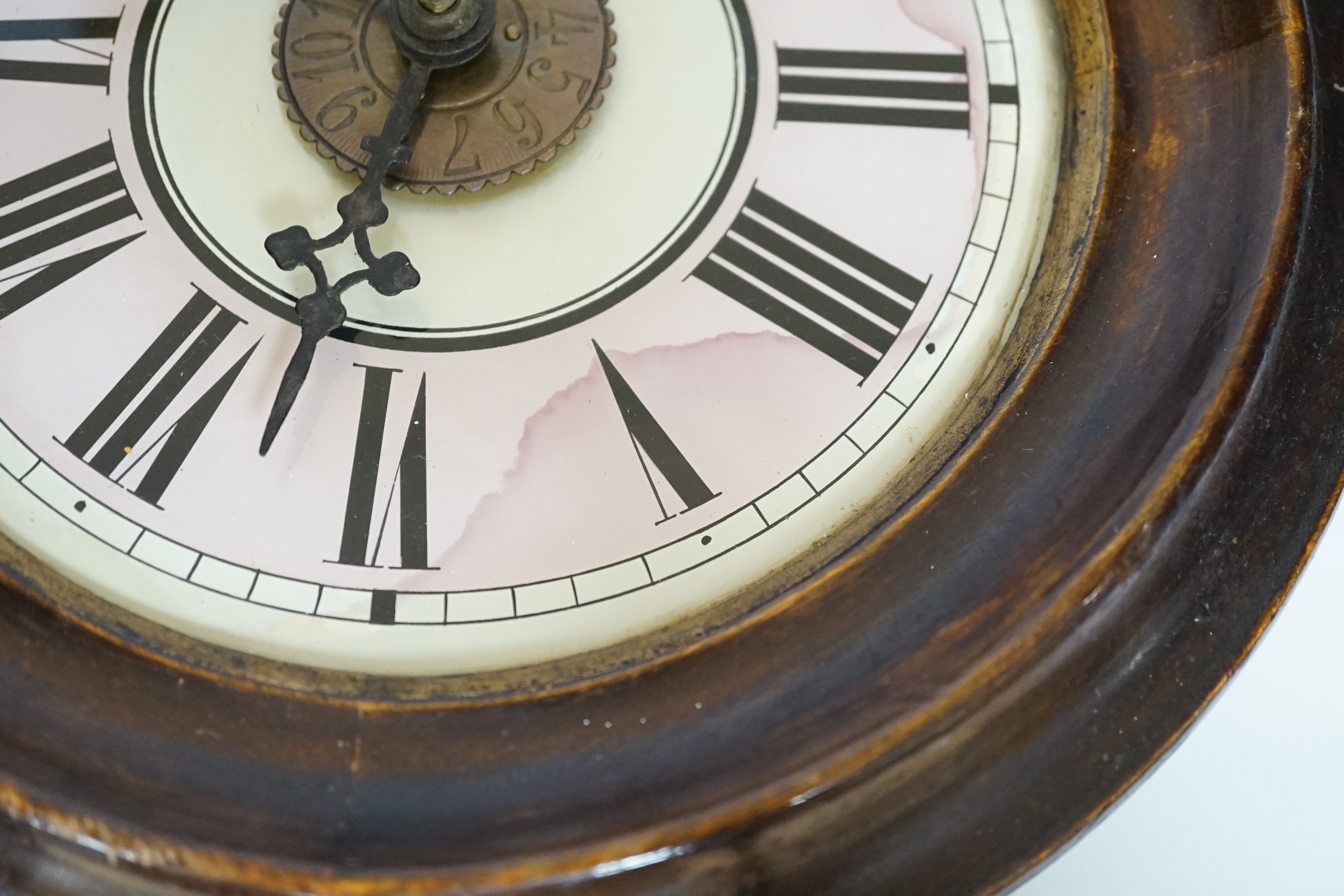 An antique postman's alarm clock with pendulum and weights, 27cm